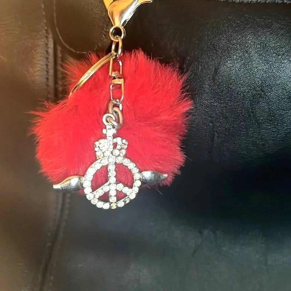 Purse Charm with Peace Sign with wings and Red Pom Pom. Purse Charm w/Key Ring